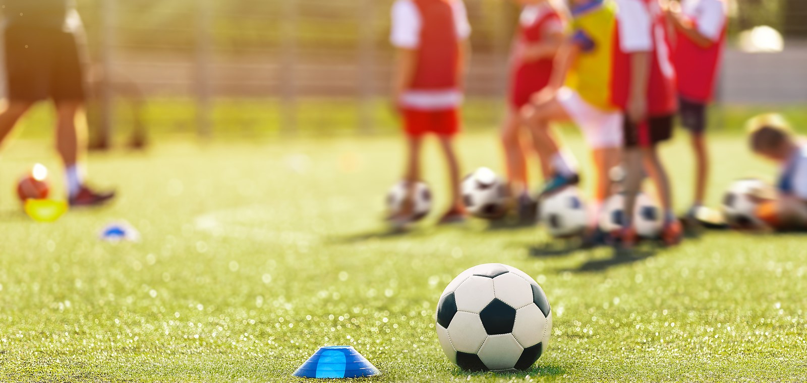 bigstock-Soccer-Training-And-Children-476974929 Soccer, Training And Children On Sports Field. Football Equipment At Sports Grass Pitch. Soccer Ball