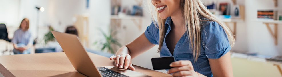 Happy young woman doing e-shopping. Happy young woman doing e-shopping.